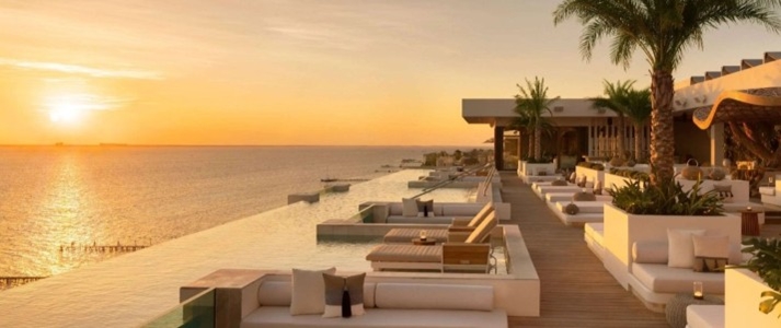 Impression Isla Mujeres by Secrets - Rooftop Pool Sunset - Book on ClassicTravel.com